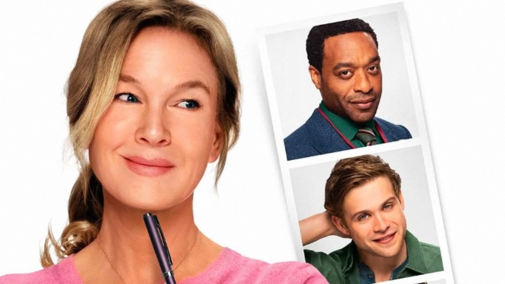 Aktorka Renée Zellweger w różowej bluzce patrzy na zdjęcia dwóch mężczyzn
