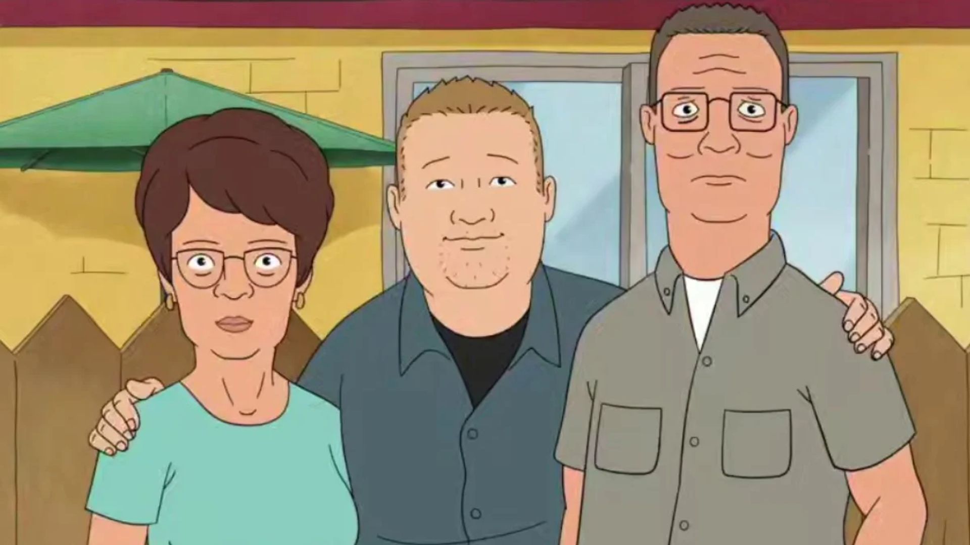 Scena z serialu animowanego King of the Hill, Hank, Bobby i Peggy Hill się przytulają